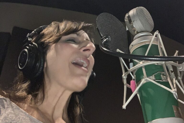Singer and voiceover talent, Melissa Barber, in the recording studio.